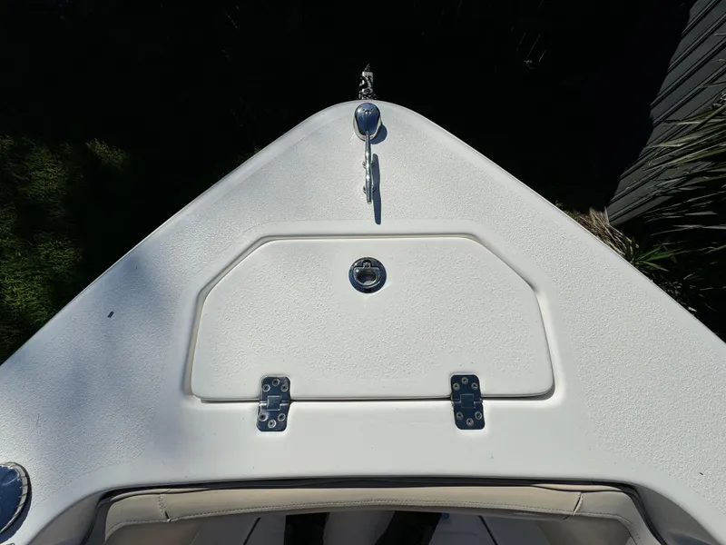 Slide: The Image of 2017 NauticStar 20 XS Offshore boat bow with storage compartment. - 13