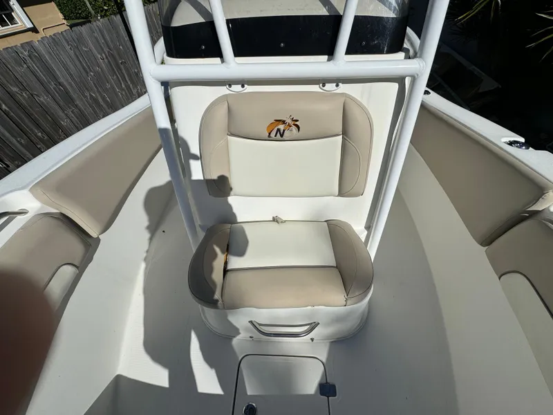 Slide: The Image of 2017 NauticStar 20 XS Offshore boat seating area with cushioned seats. - 17