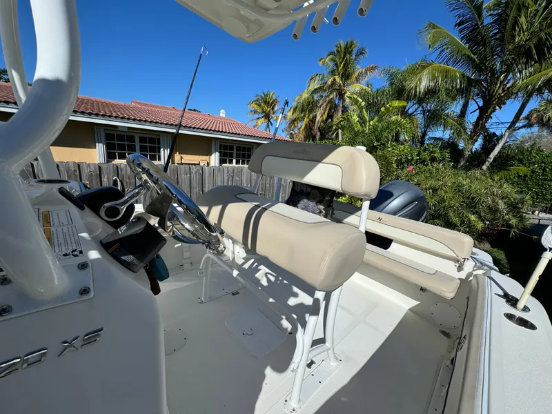 Slide: The Image of 2017 NauticStar 20 XS Offshore boat interior with steering wheel and seating. - 20