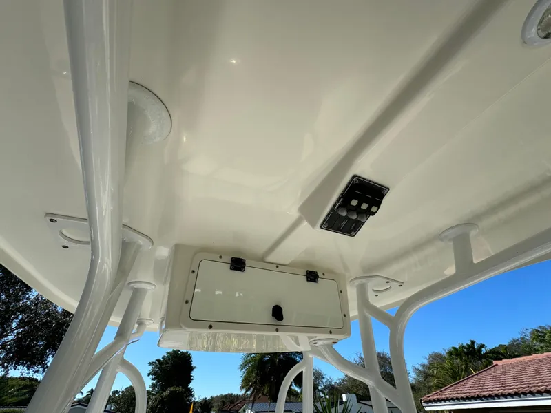 Slide: The Image of 2017 NauticStar 20 XS Offshore boat interior roof with storage compartment and control panel. - 32