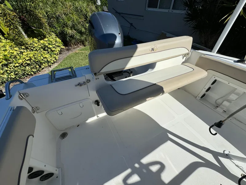 Slide: The Image of 2017 NauticStar 20 XS Offshore boat interior with seating and motor. - 33