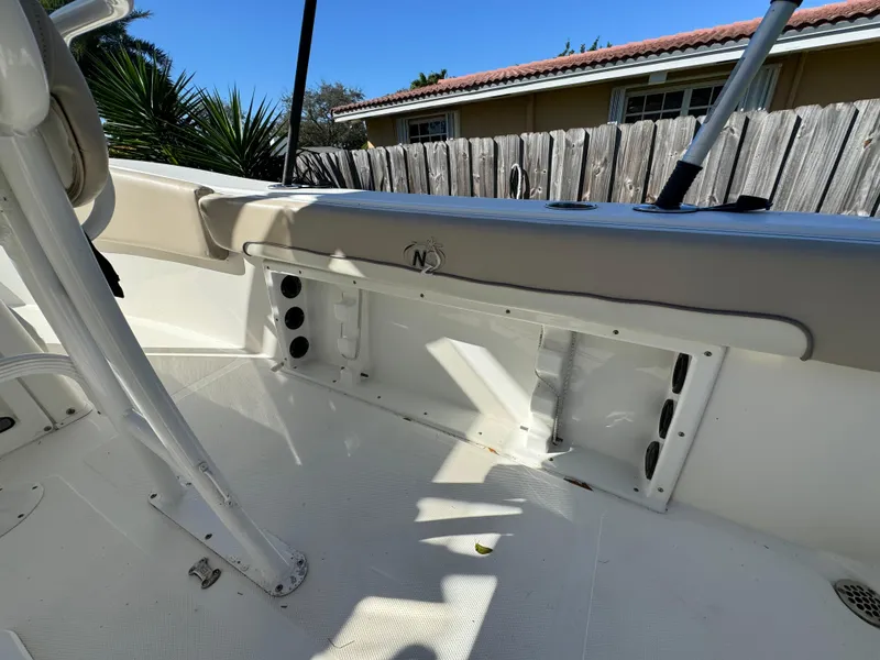 Slide: The Image of 2017 NauticStar 20 XS Offshore boat interior, showing storage compartment and seating area. - 39