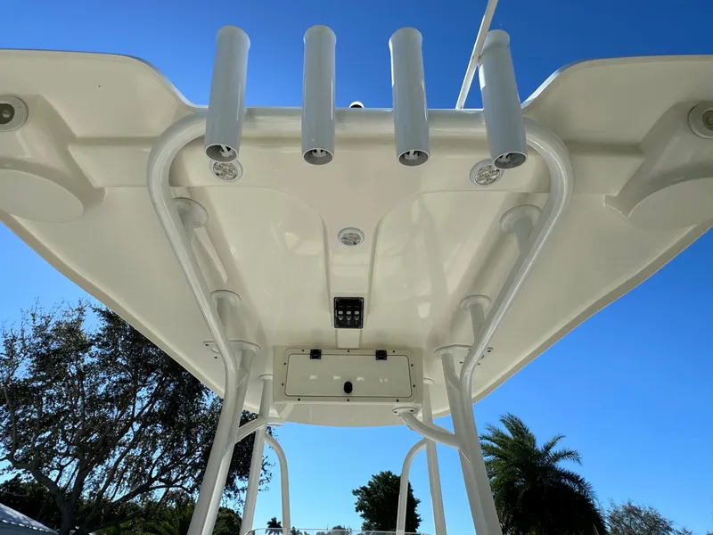 Slide: The Image of 2017 NauticStar 20 XS Offshore boat T-top with rod holders. - 40