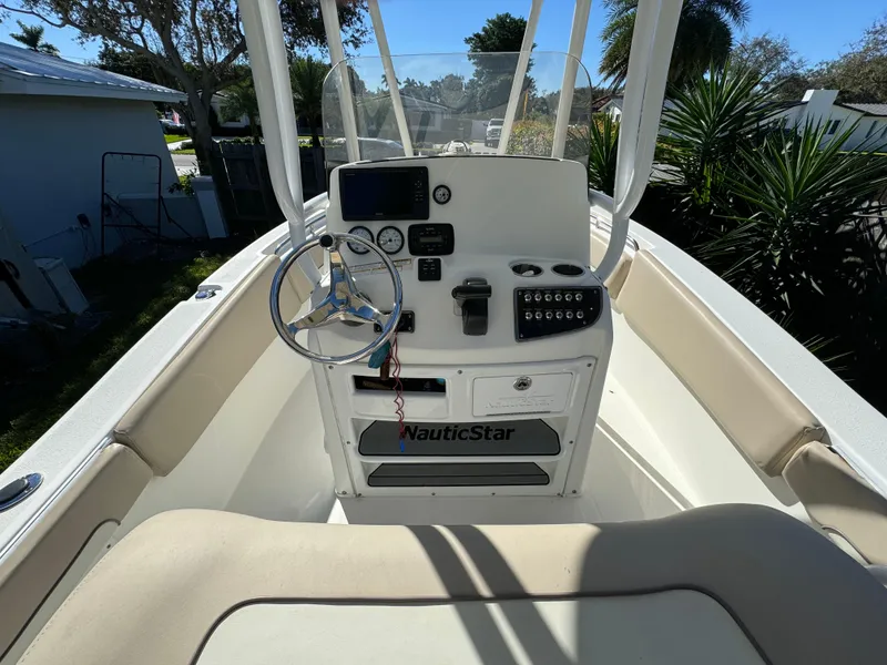Slide: The Image of 2017 NauticStar 20 XS Offshore boat console with steering wheel and navigation equipment. - 41