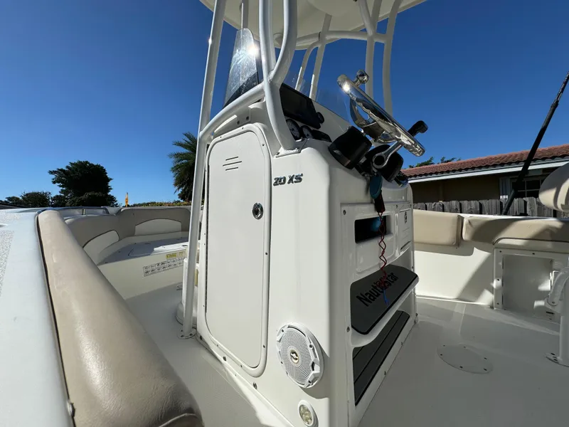 Slide: The Image of 2017 NauticStar 20 XS Offshore boat interior with steering console and seating. - 45