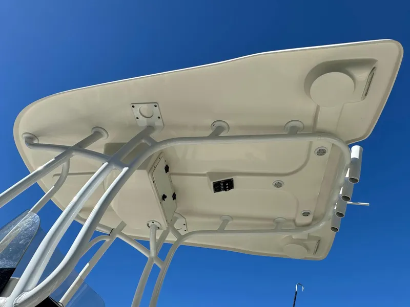 Slide: The Image of 2017 NauticStar 20 XS Offshore boat T-top under clear blue sky. - 46