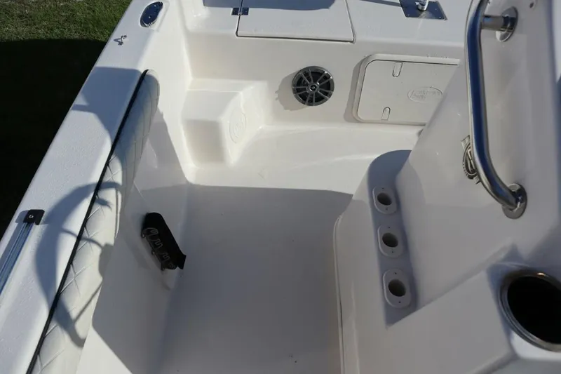 Slide: The Image of Interior of 2023 Carolina Skiff 17 LS boat, featuring seating and storage compartments. - 11