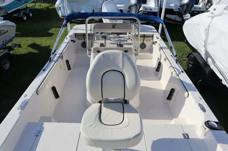 Slide: The Image of 2023 Carolina Skiff 17 LS boat interior with seating and steering console. - 12