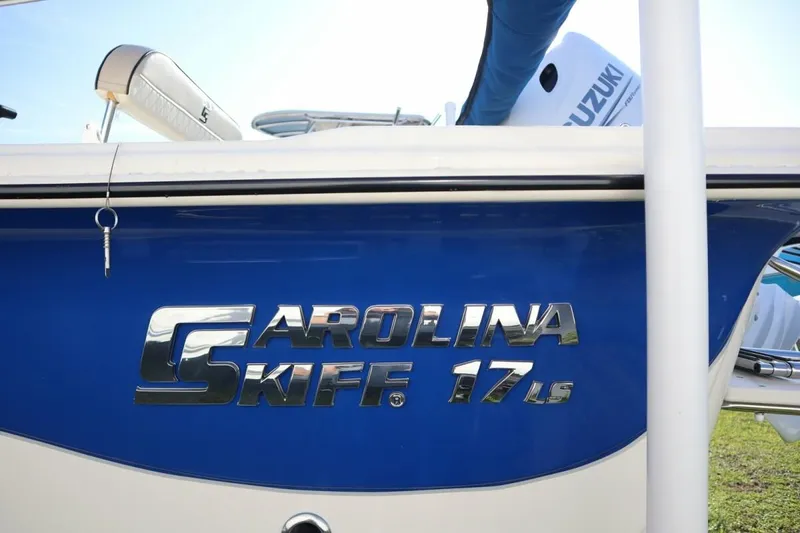 Slide: The Image of 2023 Carolina Skiff 17 LS boat side view with logo and key. - 6