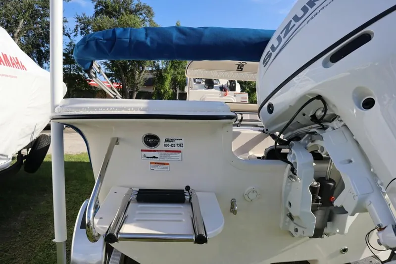 Slide: The Image of 2023 Carolina Skiff 17 LS boat with Suzuki outboard motor and swim ladder. - 7