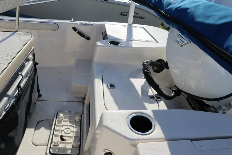 Slide: The Image of Interior of 2023 Carolina Skiff 17 LS boat with seating and storage compartments. - 9