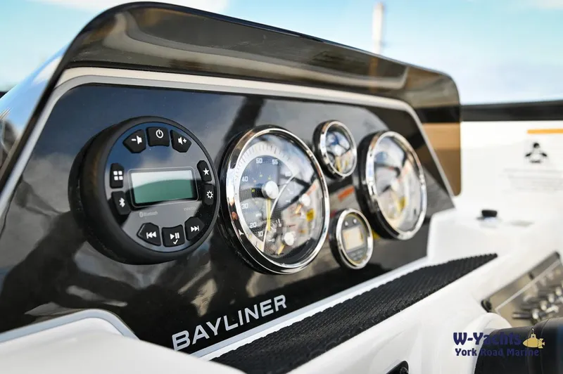 Slide: The Image of Close-up of 2024 Bayliner DX2000 dashboard with gauges and controls. - 10
