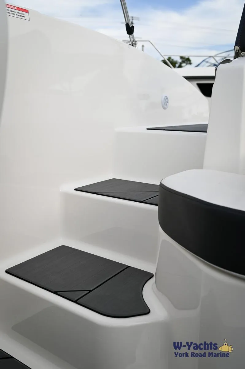 Slide: The Image of 2024 Bayliner DX2000 boat steps with non-slip pads, showcased by W-Yachts at York Road Marine. - 19