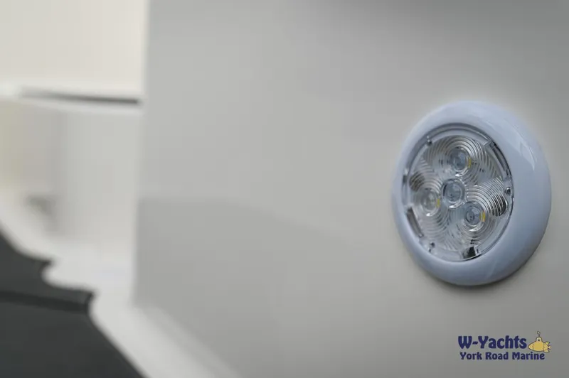 Slide: The Image of Close-up of a 2024 Bayliner DX2000 boat's LED light. - 20