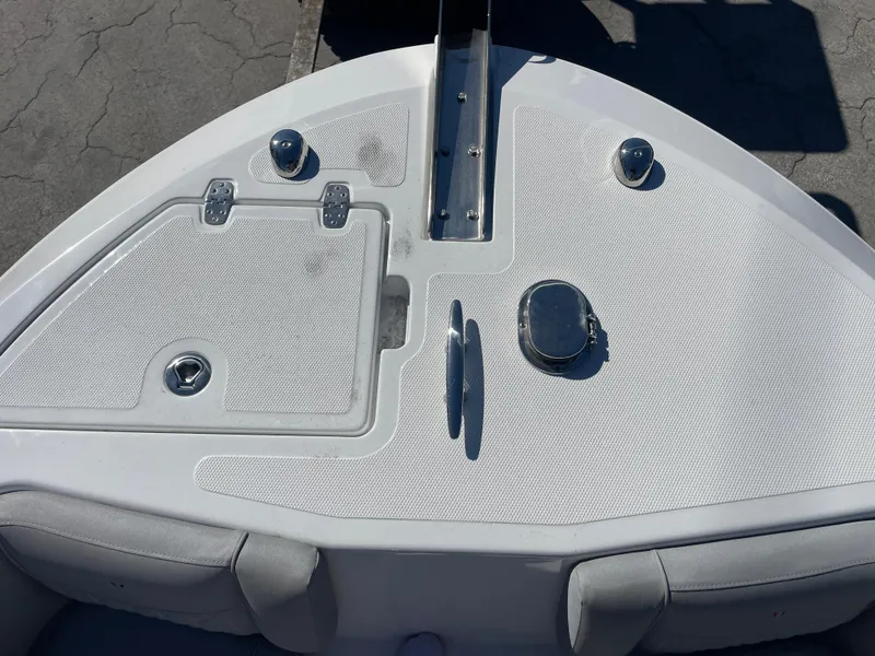 Slide: The Image of 2023 Wellcraft 222 Fisherman boat bow with storage compartments and cleats. - 16