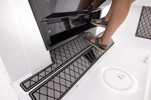 Slide: The Image of 2023 Wellcraft 222 Fisherman boat interior with non-slip flooring and footrest. - 29