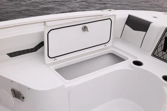 Slide: The Image of 2023 Wellcraft 222 Fisherman boat storage compartment and seating area. - 31