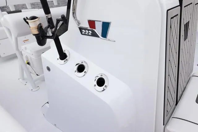 Slide: The Image of 2023 Wellcraft 222 Fisherman boat console with rod holders and cup holder. - 32