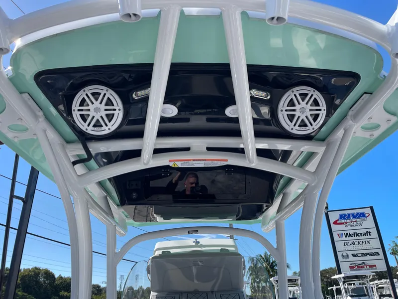 Slide: The Image of 2023 Wellcraft 222 Fisherman boat with overhead speakers and T-top. - 9