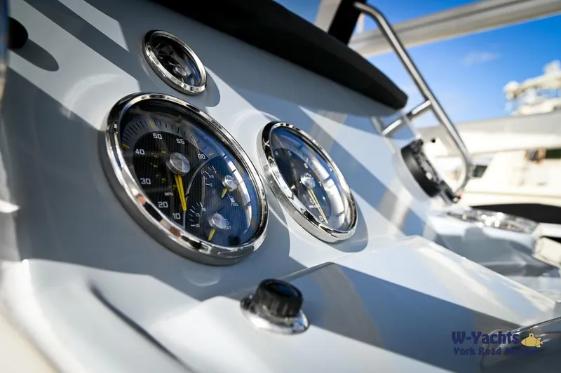 Slide: The Image of Close-up of the 2024 Bayliner T20 boat dashboard with gauges and controls. - 12
