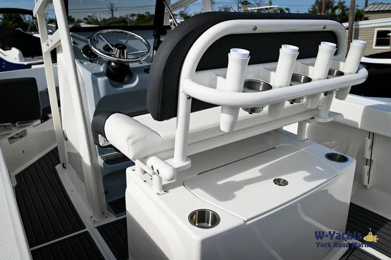 Slide: The Image of 2024 Bayliner T20 boat interior with rod holders and steering wheel. - 15