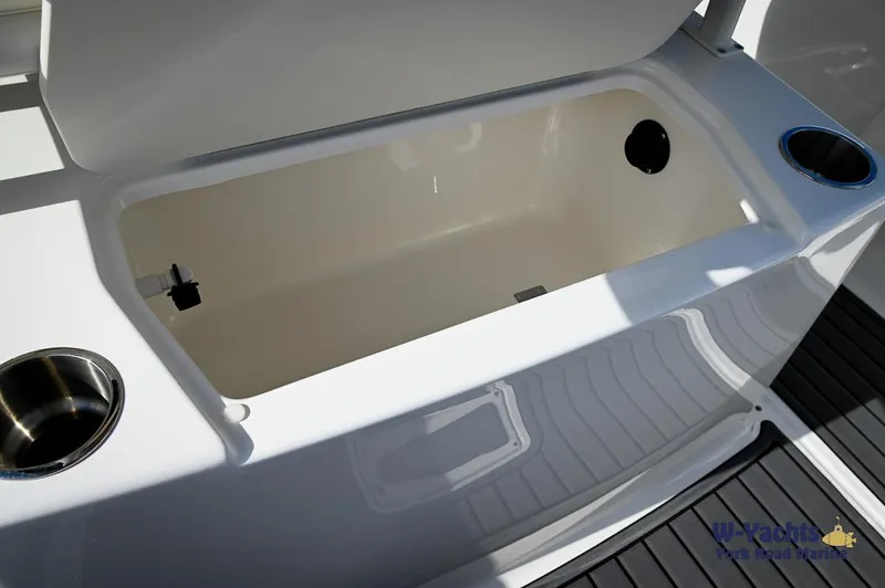 Slide: The Image of 2024 Bayliner T20 boat storage compartment with cup holders. - 16