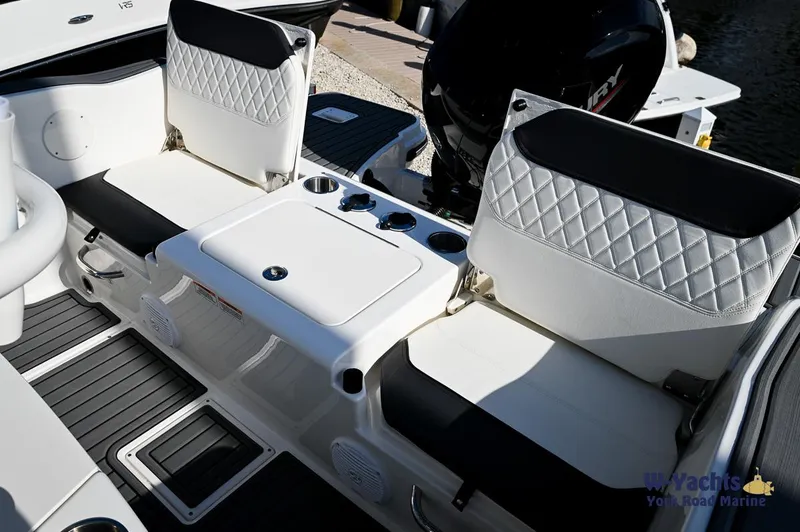Slide: The Image of 2024 Bayliner T20 boat interior with cushioned seating and storage compartments. - 20