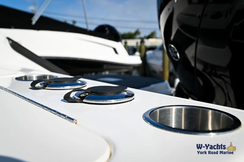 Slide: The Image of 2024 Bayliner T20 boat deck with cup holders and cleats, showcased by W-Yachts York Road Marine. - 22