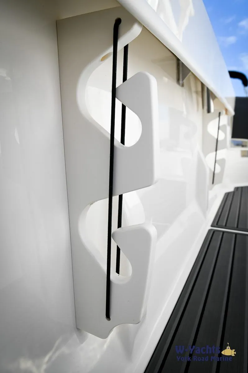 Slide: The Image of 2024 Bayliner T20 boat rod holders and deck detail. - 28