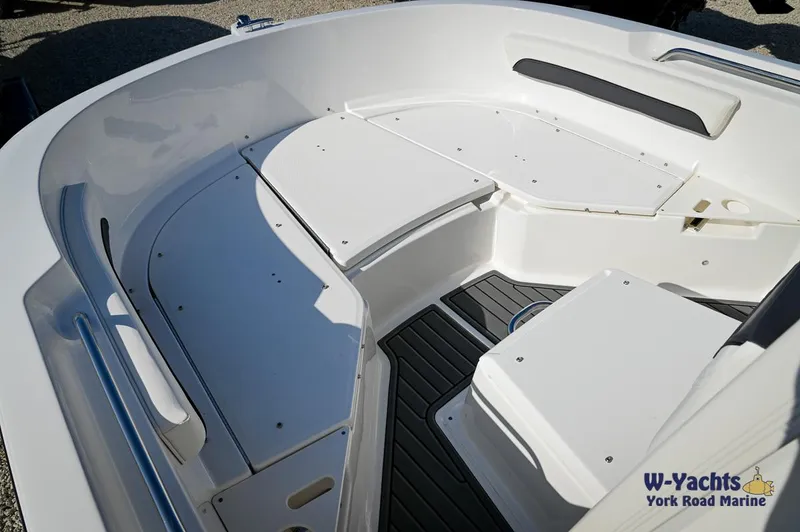 Slide: The Image of 2024 Bayliner T20 boat interior seating area with storage compartments. - 3