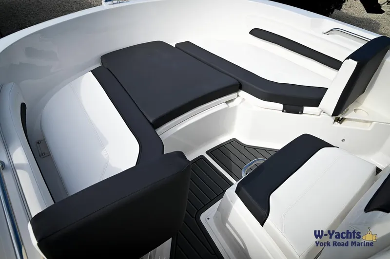 Slide: The Image of 2024 Bayliner T20 boat interior with black and white seating. - 5