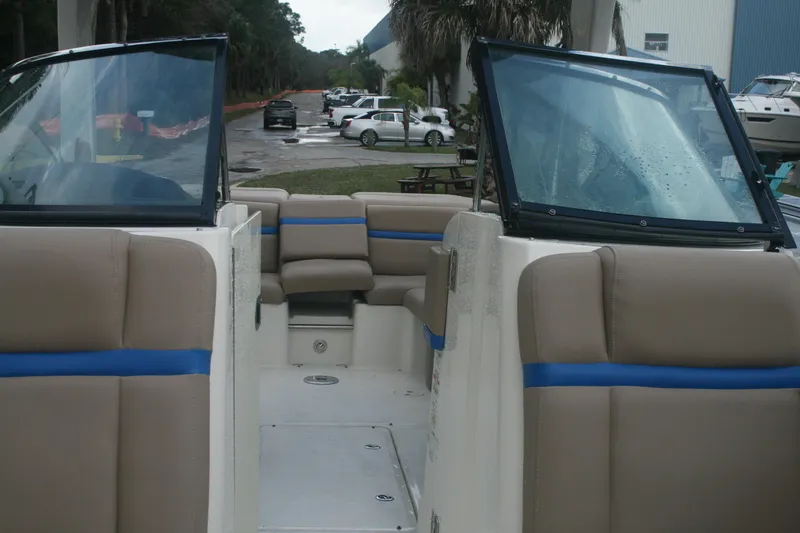 Slide: The Image of 2014 Sea Ray 270 SLX boat interior with beige and blue seating. - 10