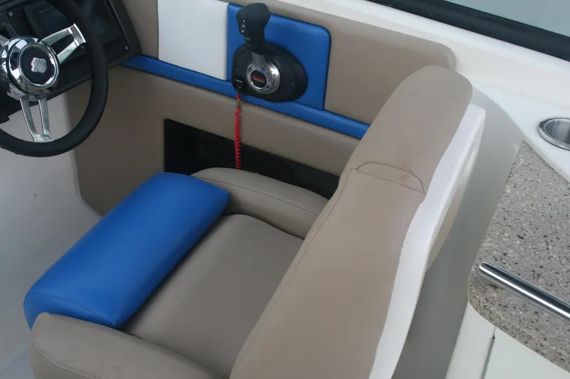 Slide: The Image of Captain's seat and control panel of a 2014 Sea Ray 270 SLX boat. - 15