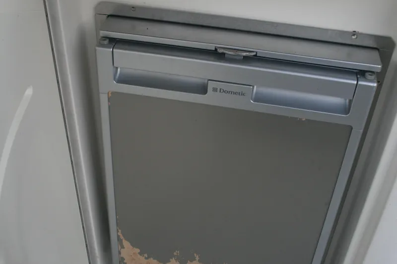 Slide: The Image of Dometic refrigerator door in a 2014 Sea Ray 270 SLX boat. - 16