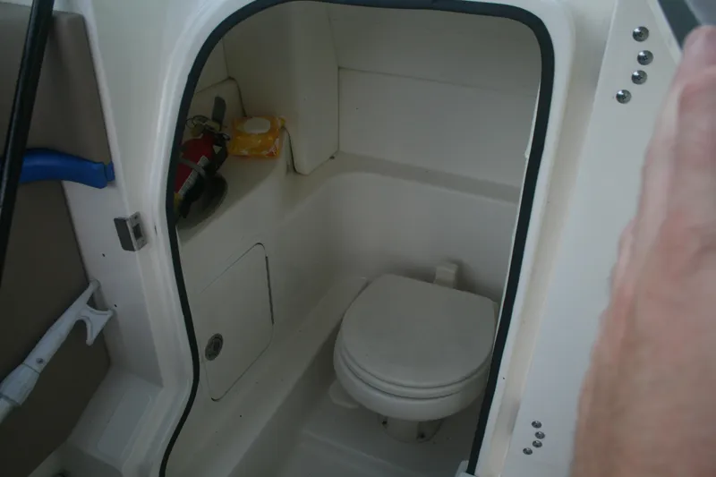 Slide: The Image of 2014 Sea Ray 270 SLX boat interior bathroom with toilet and storage. - 20