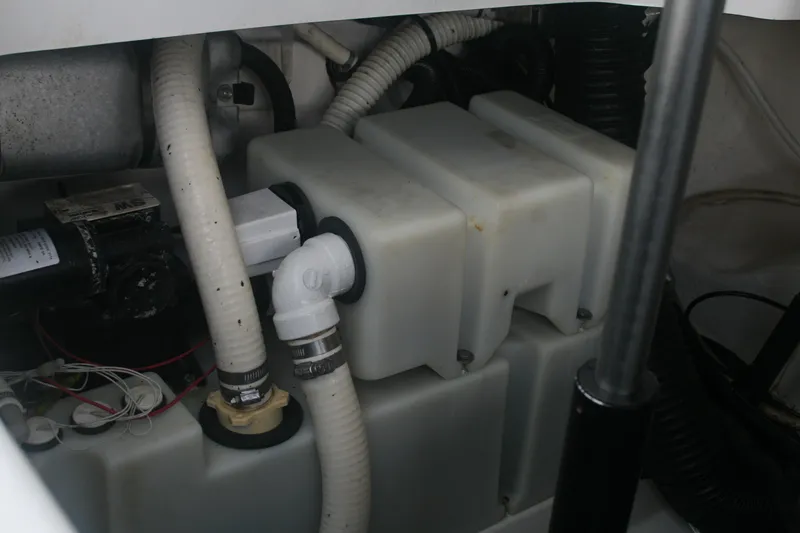 Slide: The Image of Engine compartment of a 2014 Sea Ray 270 SLX boat showing hoses and components. - 21