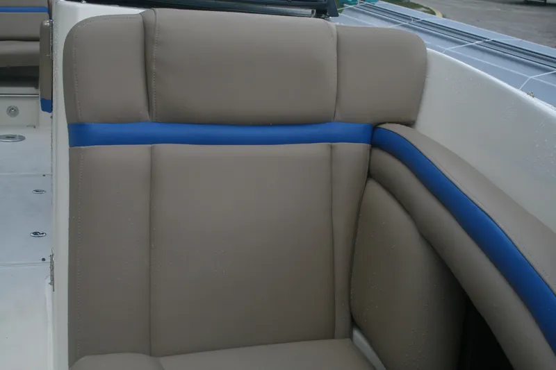 Slide: The Image of 2014 Sea Ray 270 SLX boat interior with beige and blue upholstery. - 8