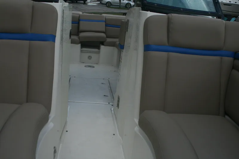 Slide: The Image of Interior seating of a 2014 Sea Ray 270 SLX boat with beige and blue upholstery. - 9
