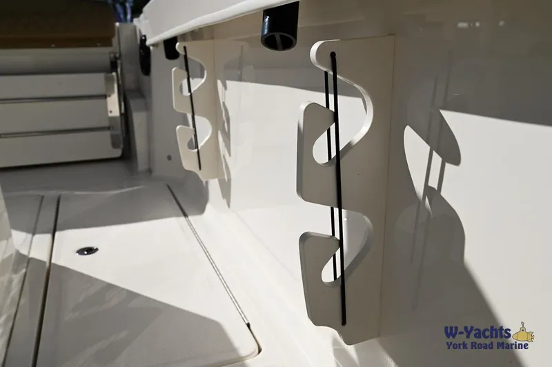 Slide: The Image of Bayliner T24 2023 boat interior with rod holders, W-Yachts York Road Marine. - 16