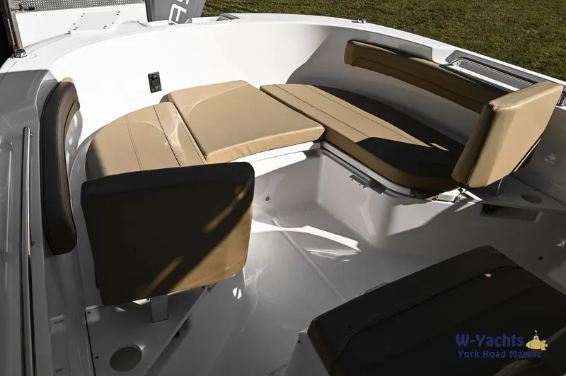 Slide: The Image of 2023 Bayliner T24 boat interior with cushioned seating. - 19