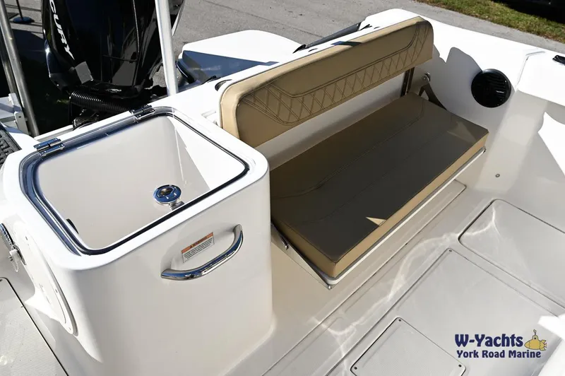 Slide: The Image of 2023 Bayliner T24 boat interior with seating and storage compartment. - 4