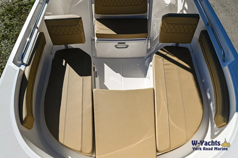 Slide: The Image of 2023 Bayliner T24 boat interior with tan seating, W-Yachts York Road Marine. - 6