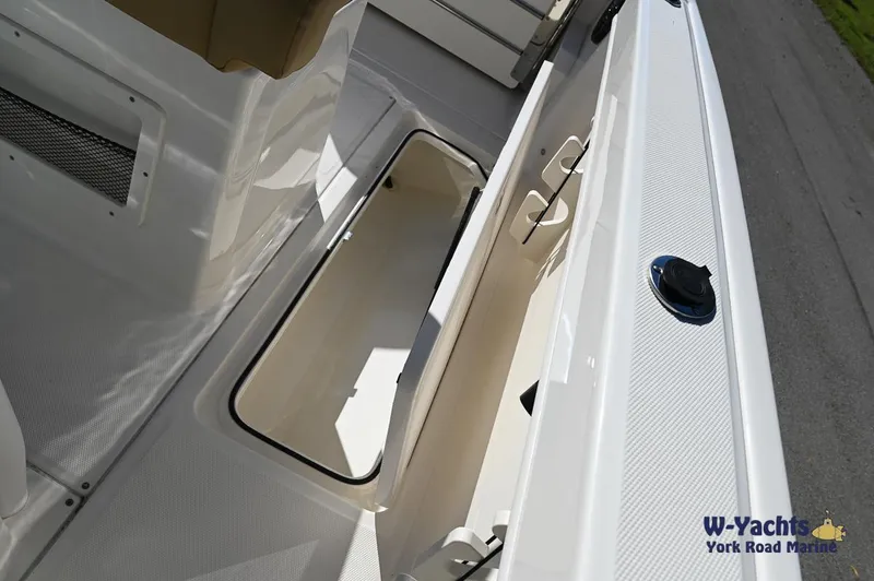Slide: The Image of 2023 Bayliner T24 boat storage compartment, white interior, W-Yachts York Road Marine. - 9