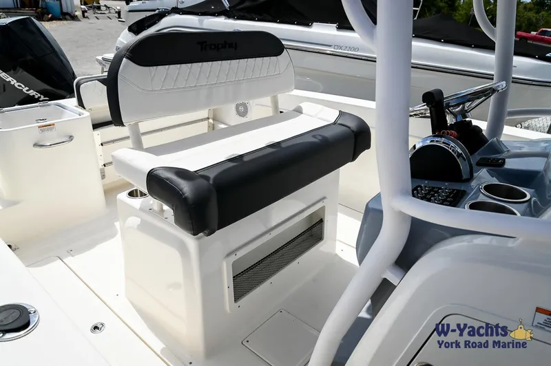 Slide: The Image of 2023 Bayliner T24 boat interior with seating and control console at W-Yachts York Road Marine. - 10