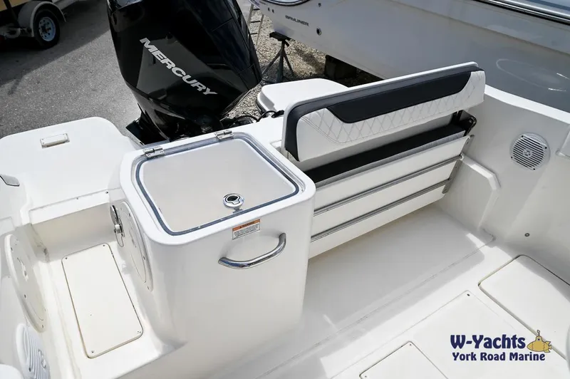 Slide: The Image of 2023 Bayliner T24 boat interior with Mercury outboard motor and seating area. - 20