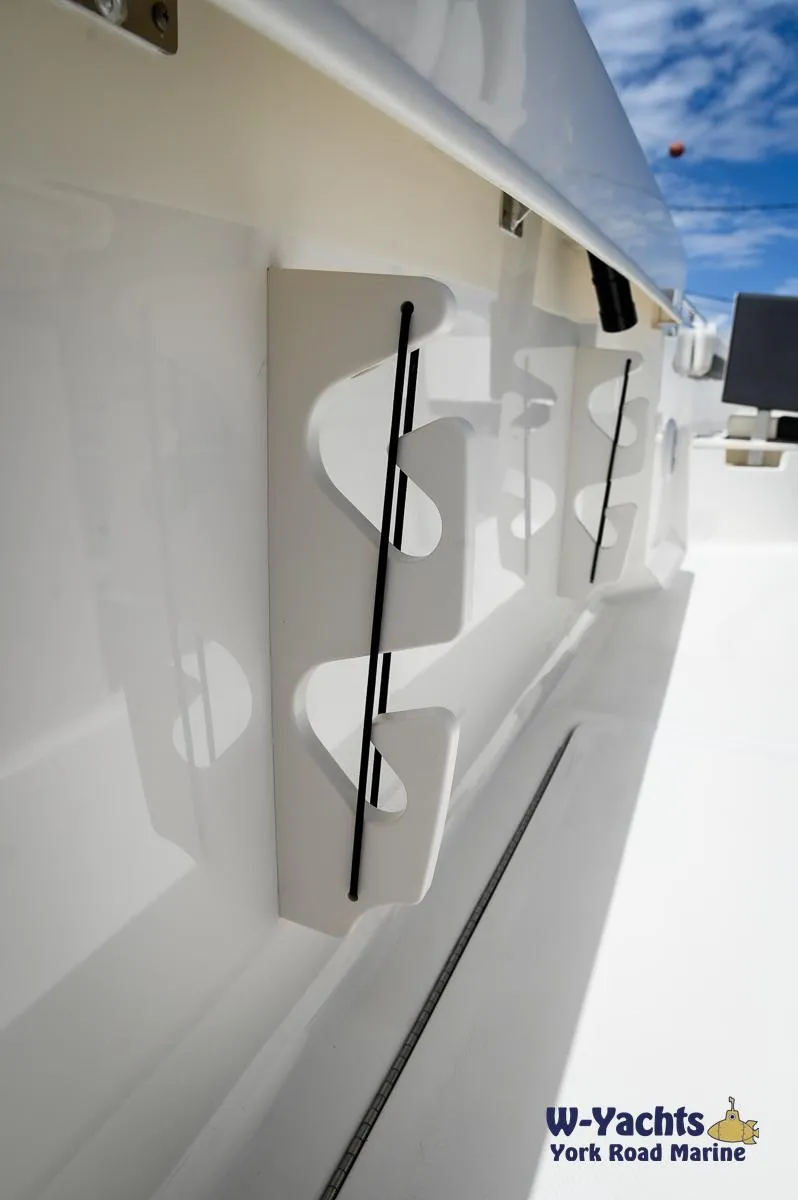 Slide: The Image of 2023 Bayliner T24 boat interior with rod holders, W-Yachts York Road Marine. - 24