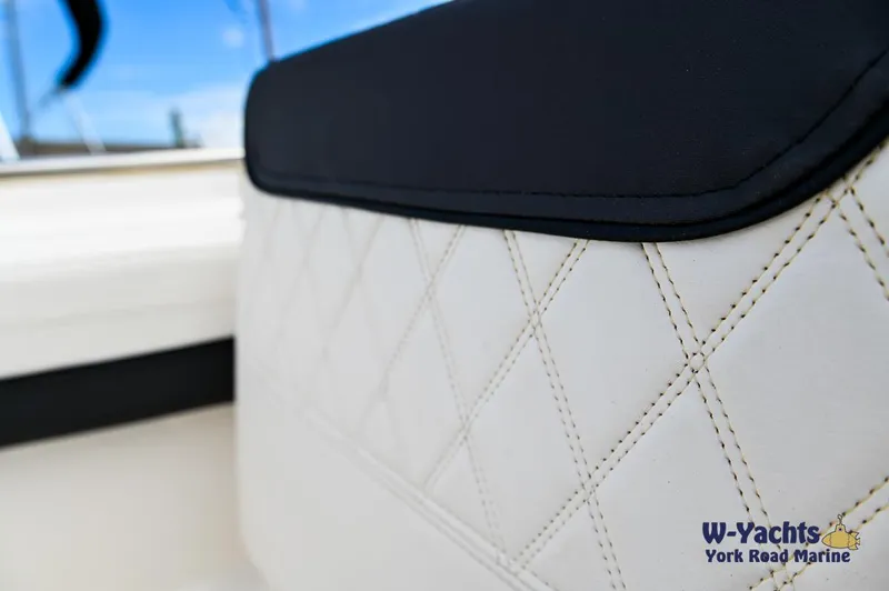 Slide: The Image of Close-up of 2023 Bayliner T24 boat's white diamond-stitched upholstery. - 26