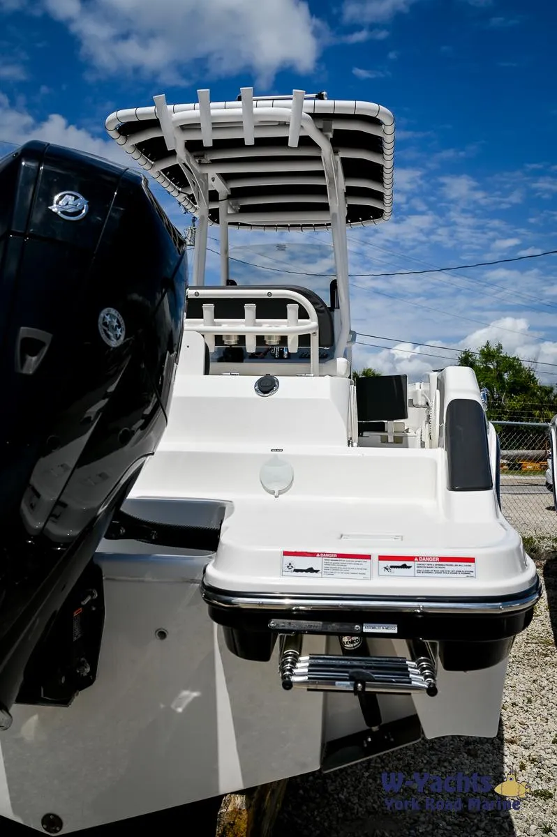 Slide: The Image of 2023 Bayliner T24 boat with outboard motor and swim platform. - 27