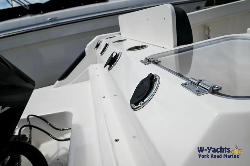 Slide: The Image of 2023 Bayliner T24 boat interior with seating and control panel. - 29