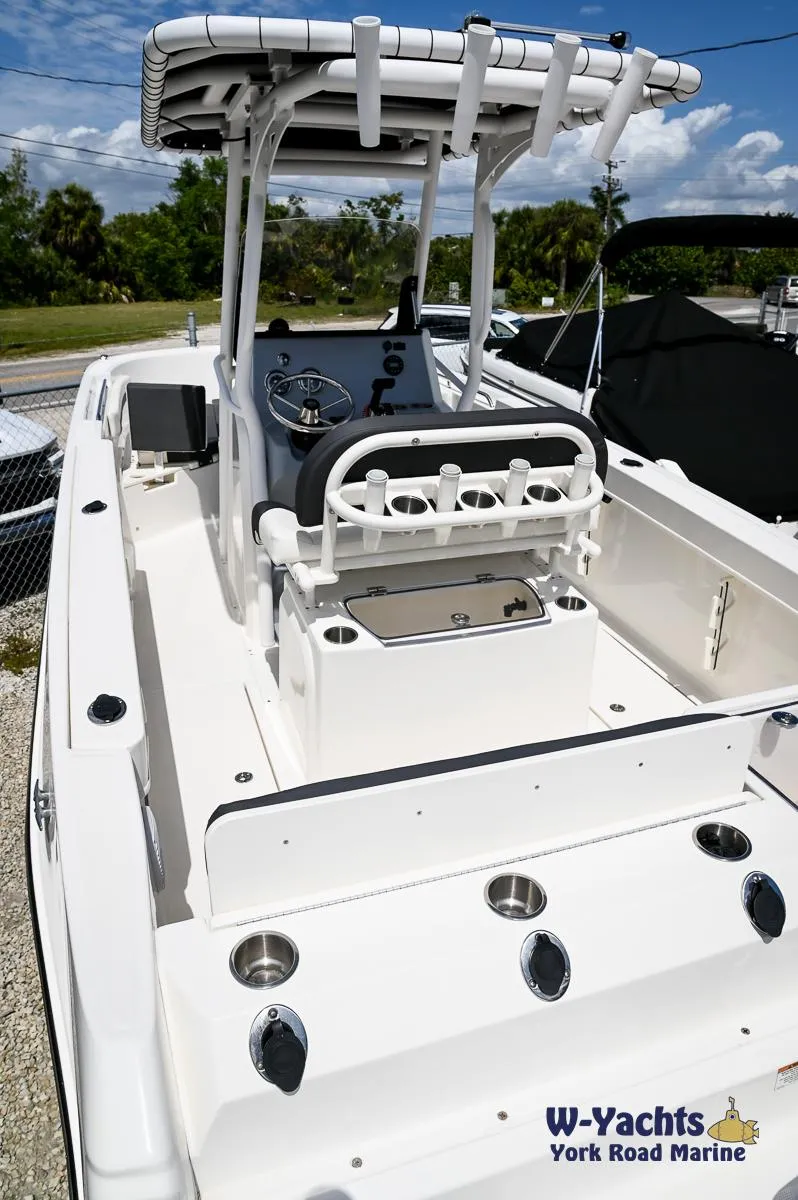 Slide: The Image of 2023 Bayliner T24 boat with center console and rod holders at W-Yachts York Road Marine. - 4